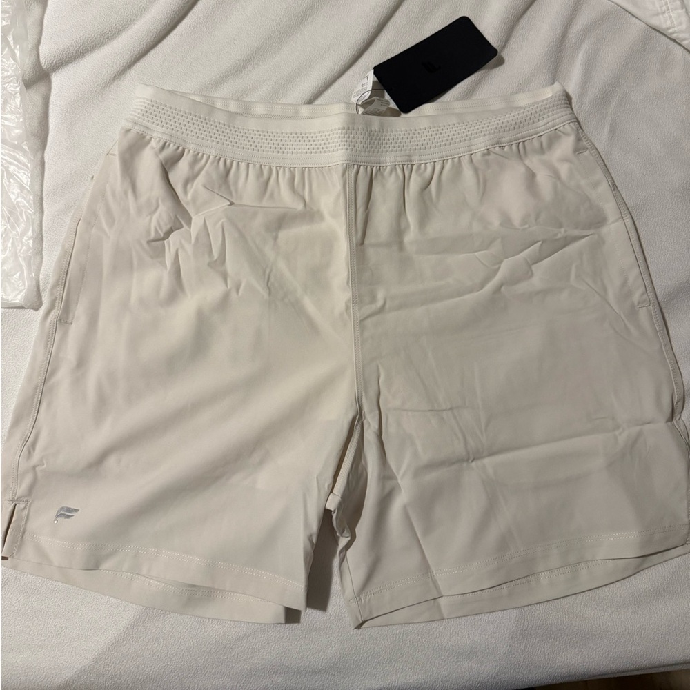 Men’s Fabletics fundamental shorts (5” inseam) lined, in bone white color.